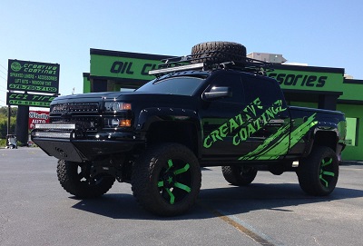 Business logo on lifted truck with custom wheels